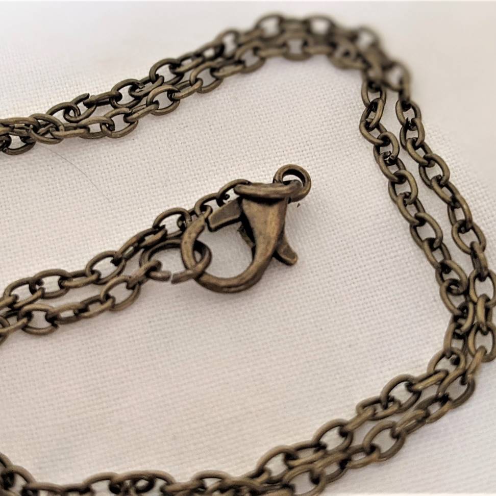 Embroidered roses teardrop pendant