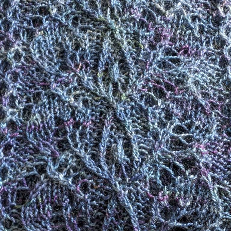 Leaves and crossing stems pattern hand-knitted lace