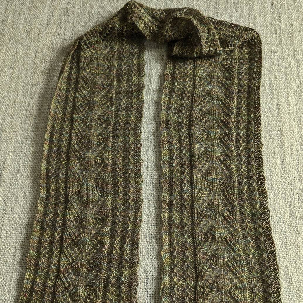 Narrow lace hand-knitted scarf